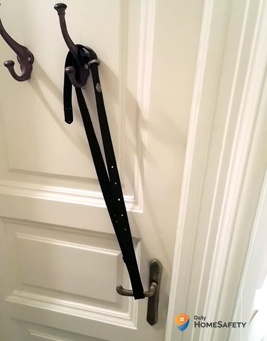 Locking a bathroom door with a belt